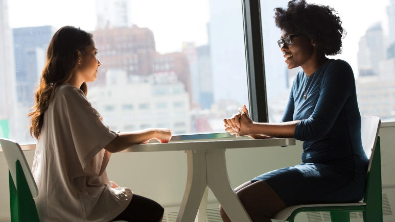 Phot of two women talking 